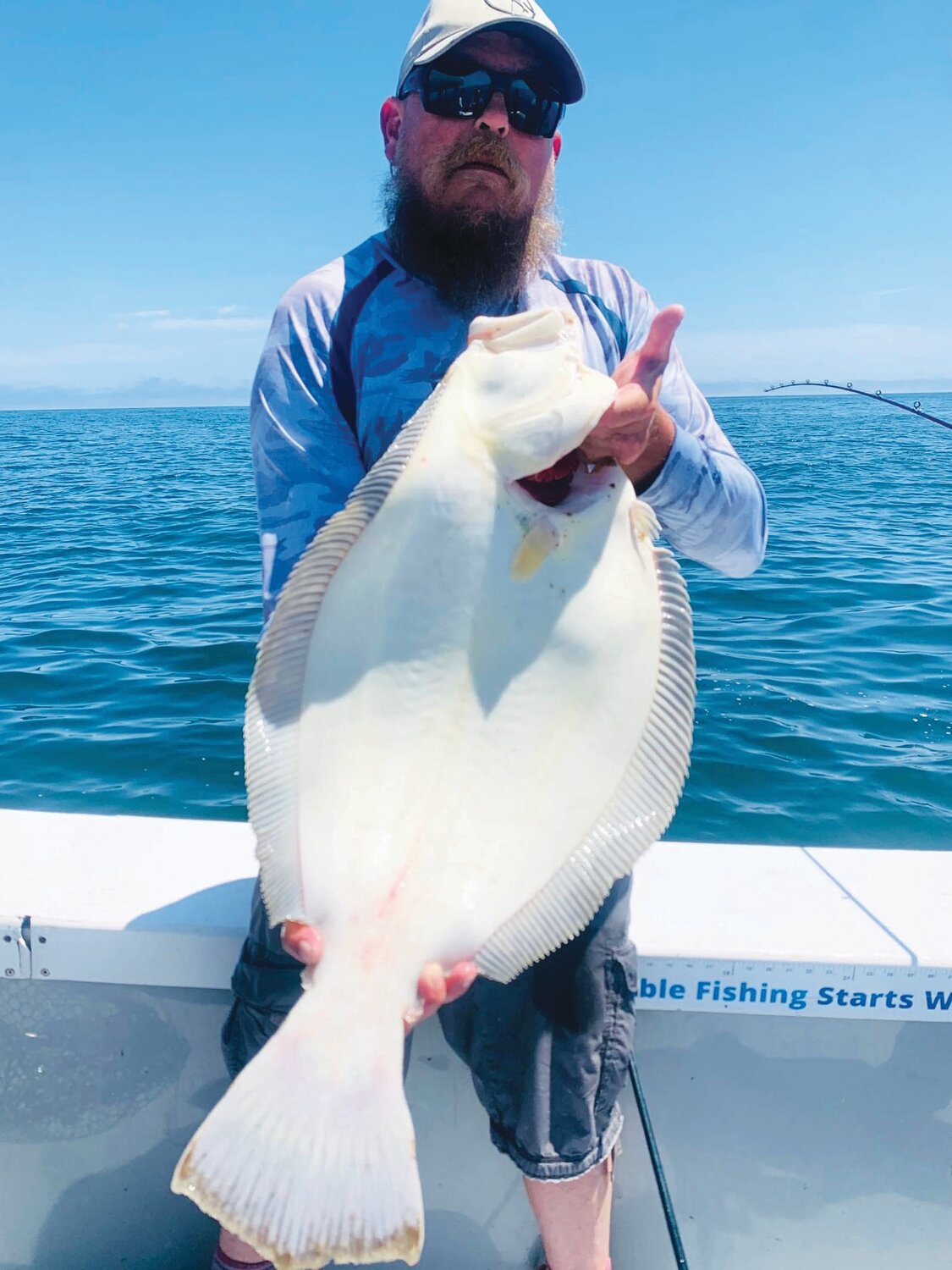 FLOUNDER: Capt. John Lee of JL Charters with a 30-inch summer flounder (fluke) caught off Pt. Judith, Narragansett, this weekend. (Submitted photo)